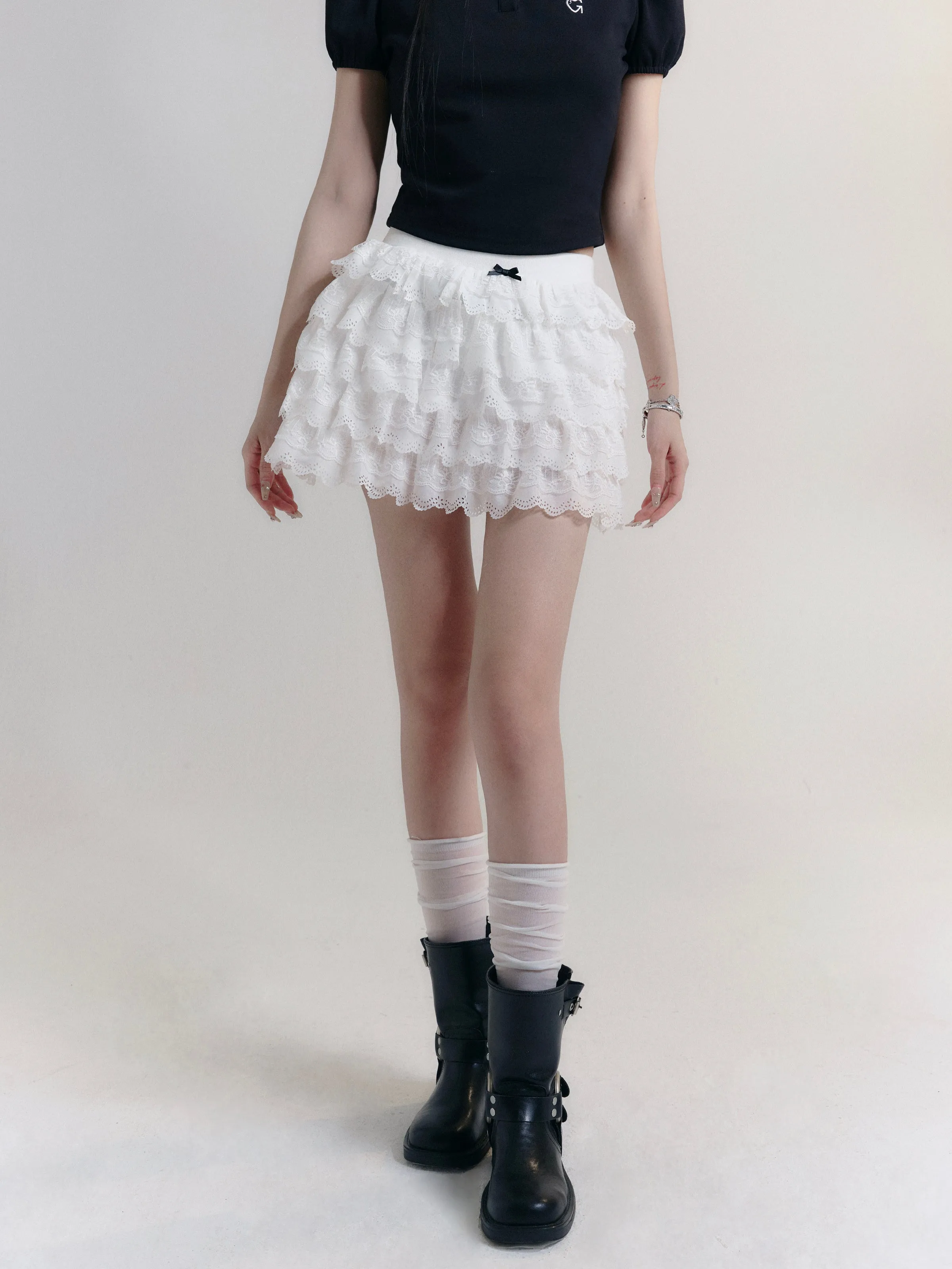 Angelic Tiers Mini Skirt: White Lace Ruffle Layers with Bow Accent