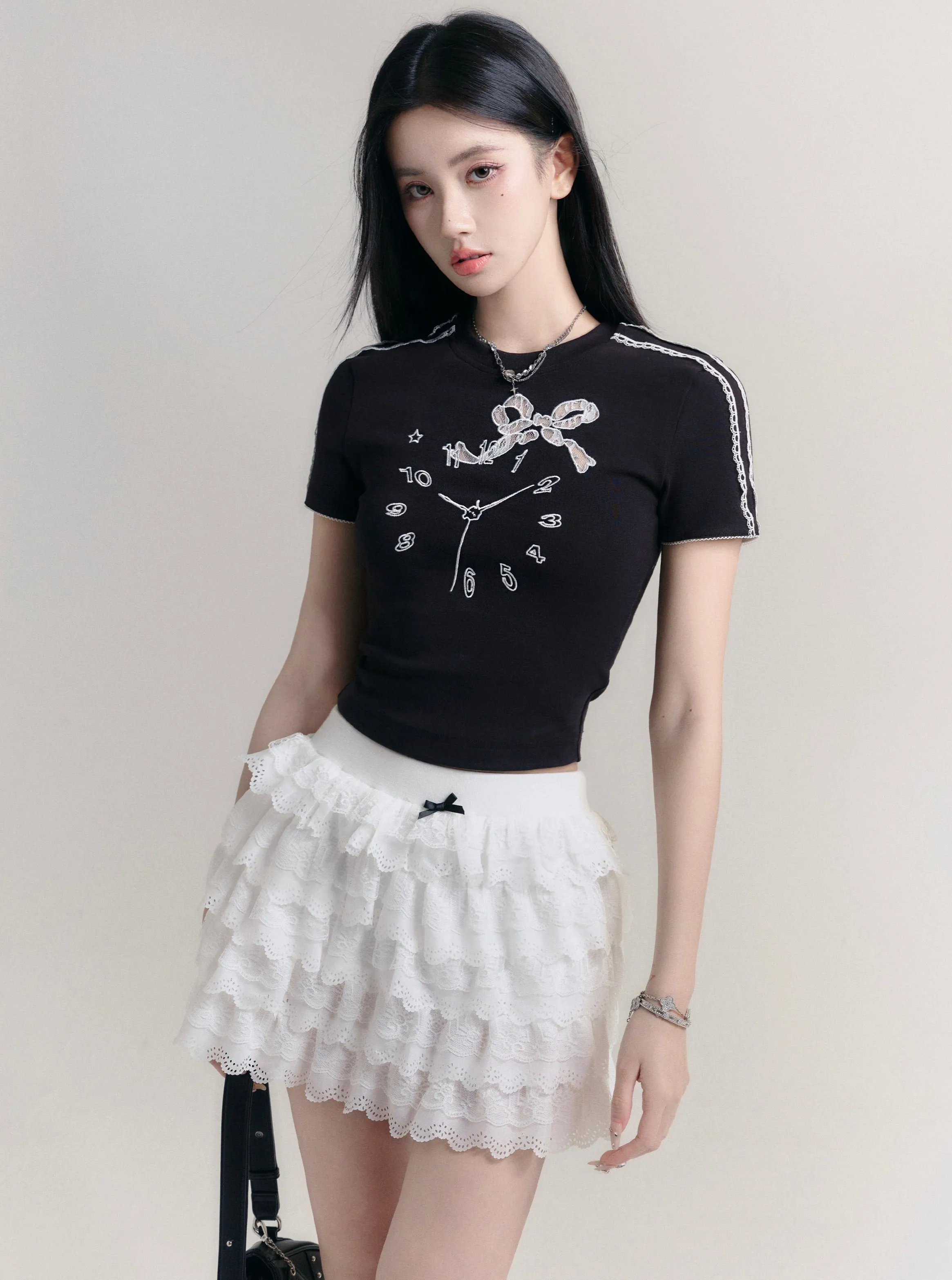 Angelic Tiers Mini Skirt: White Lace Ruffle Layers with Bow Accent